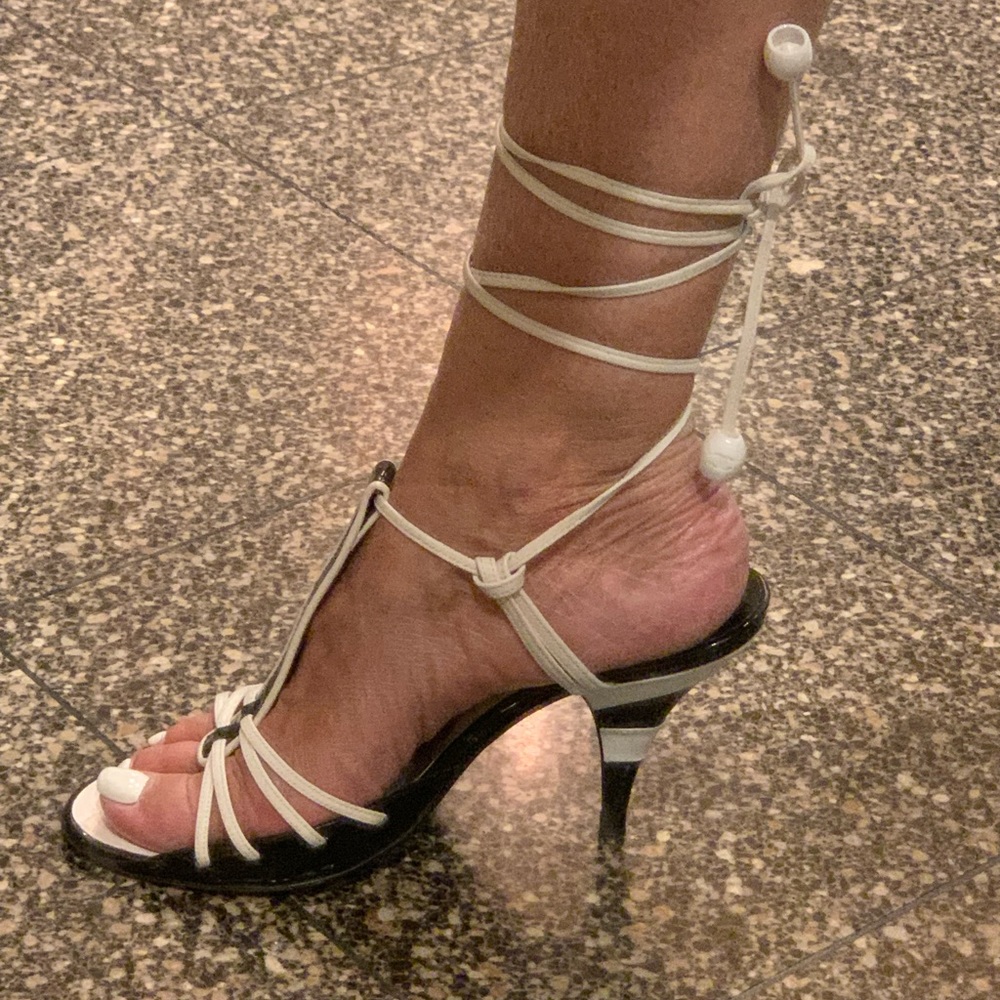 Chanel Black and White leather tie up sandals with a 3 1/2” heel.